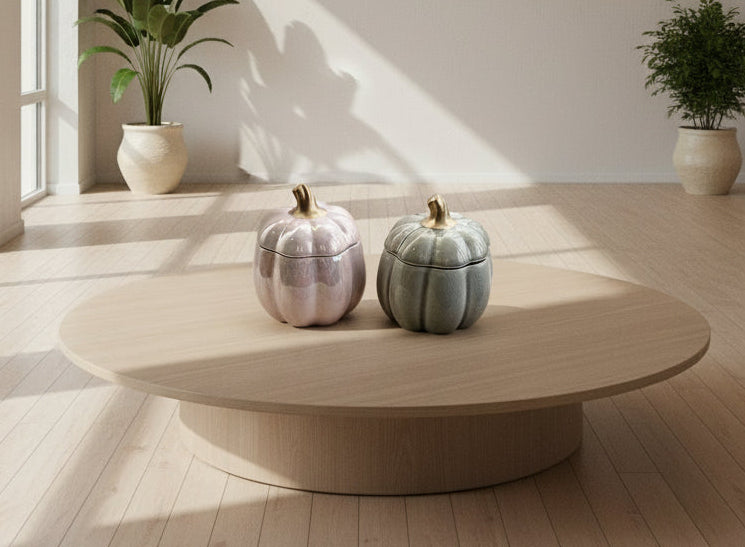 Handmade pumpkin soy candle in a ceramic jar. Cozy fall aroma and elegant design by SiL Candle Atelier.